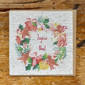 Une carte à semer, carrée, pour les fêtes de fin d'année. Avec son motif de couronne et son message "joyeux Noël" cette carte sera parfaite cet hiver !