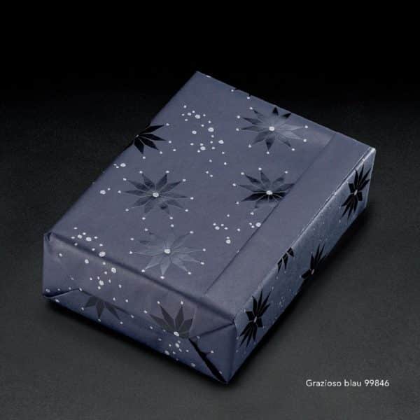 Papier cadeau bleu nuit étoilée. Motif argenté texturé.
